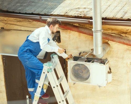 hvac-technician-working-capacitor-part-condensing-unit-male-worker-repairman-uniform-repairing-adjusting-conditioning-system-diagnosing-looking-technical-issues_155003-18259